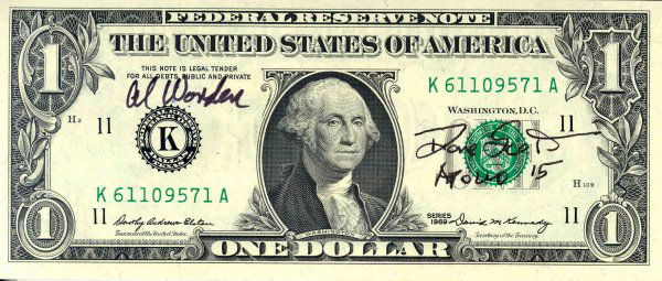 Apollo 15 Scott & Worden Autographs: 'David Scott and Alfred Worden Autographs on a 1969 one dollar Federal Reserve Note. Both autographs are executed in black Sharpie. The dollar bill bears serial number K61109571A.