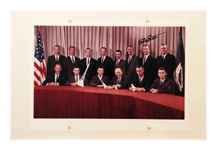 Dave Scott Autograph: Dave Scott Autograph in black ink on a color photograph (8.5x13.5") of the Group 2 NASA astronauts mounted on an ivory matboard (12x18"). Very good condition. Ex: the David Scott Collection.