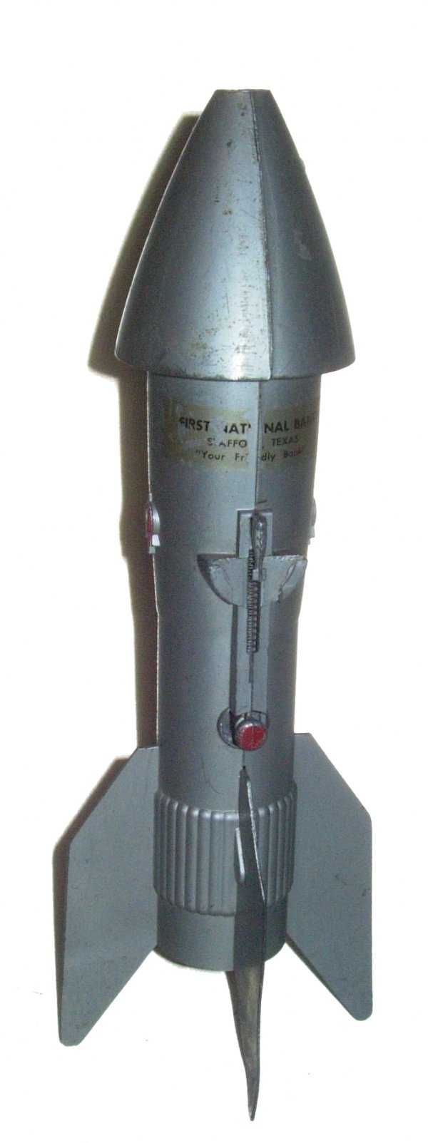 Circa 1950's Berzac Rocket Ship Mechanical Bank: (11.50") Vintage grey metal rocket makde by Astro Mfg of Detroit, MI and issued as a promotional item for First National Bank. The bank is missing the bottom closure, but the mechanism works well. I w