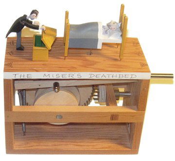 Miser's Death Bed Automata: Miser's Death Bed Mechanical Automata by Cabaret Mechanical Signed by Matt Smith (6.5 x 5.5 x 2.5") A wooden mechanical depicting a miser on his deathbed, with his butler going into the chest at the f