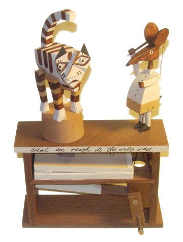 "Treat "em Rough" Automata: "Treat "em Rough, It's the Only Way" Mechanical Automata by Cabaret Mechanical Signed by Matt Smith (10 x 6.5 x 2.25") A wooden mechanical depicting a mouse whipping a tiger cat. Excellent condition.