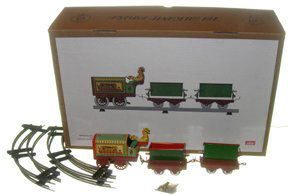 Paya 893 3 Pc Train Set Tin Toy: (Number 51 of a limited edition of 5000) (50 cm) The original of this toy was first made in 1928, this modern version of this clockwork toy features a train set with three cars. Excellent condition wi