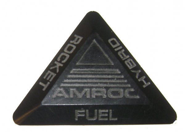 Block of AMROC Hybrid Rocket Fuel: (4 x 4 x 4") AMROC developed a family of rockets called the Industrial Launch Vehicle, which were powered by a hybrid solid fuel, liquid oxidizer engine. ILV was to use an inert hydroxyl-terminated po