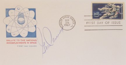 NASA Gemini Astronaut Eugene Cernan Autograph: on a first day of issue cover bearing a blue and red cachet saluting the nation's accomplishments in space, and a 5-cent space walker stamp. The cover is tied with a Kennedy Space Center cachet dated 