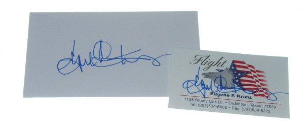 2 Apollo Flight Controller Eugene Kranz Autographs: The first is on a white index card, signed in fine blue Sharpie; the second is on one of his "Flight" business cards, signed in fine blue Sharpie. Both are in pristine condition.