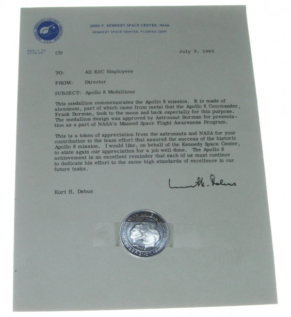 Flown Apollo 8 Manned Flight Awareness Medallion: (1.5", diameter) The reverse reads: "In appreciation for your contribution to the Apollo Saturn project. The Apollo 8 crew carried metal in this medallion on man's first flight to the moon." The obver