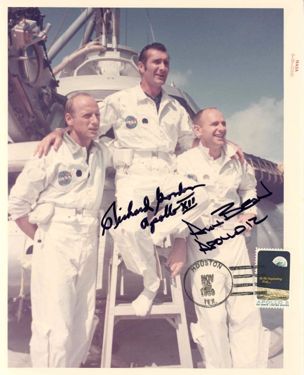 Apollo 12, Richard Gordon, Alan Bean Autographs: on a NASA official color photograph (8x10") number S-69-52989 of the Apollo 12 crew that has a 6c Apollo 8 U.S. stamp with a Houston TEX. Nov 19, 1969 cancel. Inscribed in black Sharpie "Richard Gordo