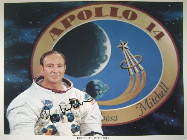 Apollo 14 Astronaut Edgar Mitchell Autograph: on an official NASA color publicity lithograph (8x10") of the astronaut in his space suit. Mitchell has signed in black Sharpie. Excellent condition.