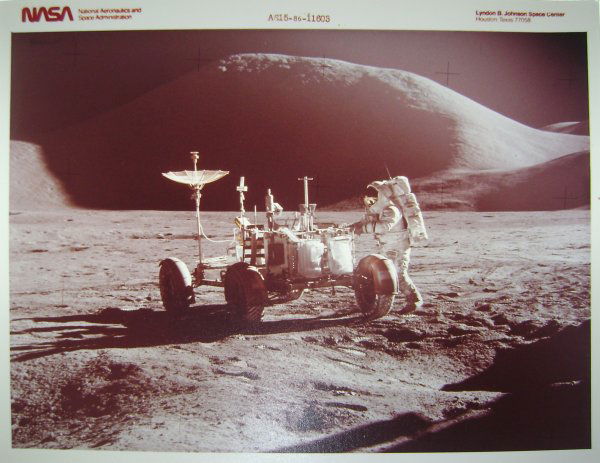 Apollo 15 NASA Red Numbered Photograph: This lot consists of an official NASA color publicity photograph (8 x 10") printed on Kodak paper red # AS15-86-11603 of astronaut Jim Irwin at the Lunar Rover. Excellent condition with toning.