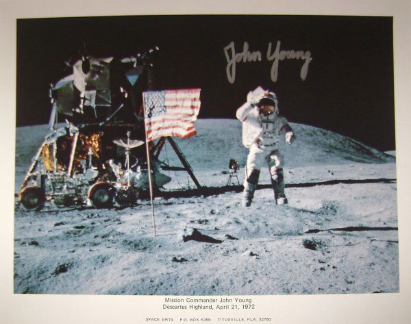 Apollo 16 Astronaut John Young Autograph: on a NASA color publicity lithograph (8.50 x 11 ") of John Young on the lunar surface. Young signed in silver Sharpie. Excellent condition.