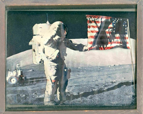 Apollo 17 Shadow Box: This lot consists of a commemorative 3D shadow box (10 x 9") fashioned from a NASA color publicity lithograph of the Gene Cernan on the lunar surface - the shadow box creates a "raised" portrait of Ce