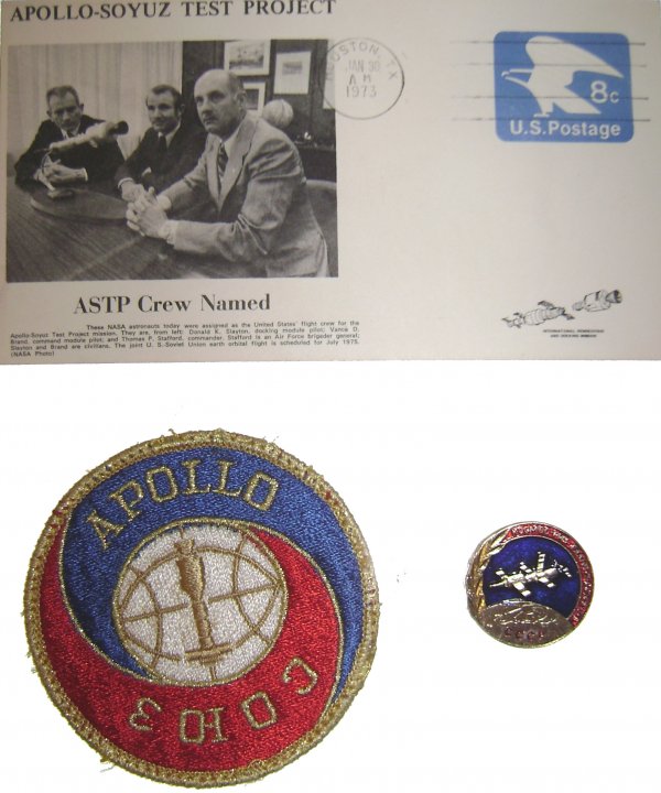ASTP Cover, Mission Patch and Pin: A lot of three ASTP commemoratives including: 1) an ASTP cover with a black and white photograph cachet of the American ASTP crew and US 8-cent preprinted postage tied with a Houston, TX cancel dated 