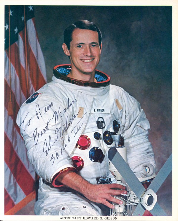 Skylab 3, Edward Gibson Autograph: on a NASA color publicity lithograph (8 x 10") of the astronaut in his space suit. Signed and inscribed "To Tim, Best Wishes" in black Sharpie. Excellent condition.