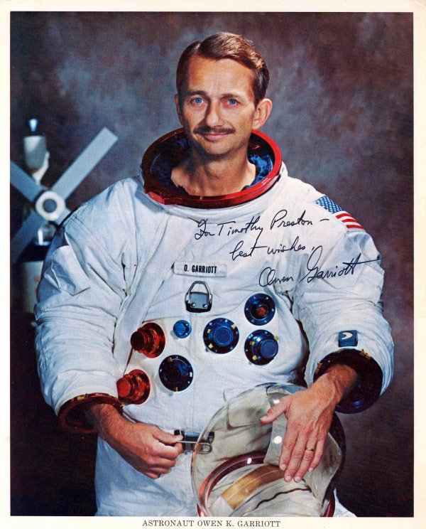 Skylab 3, Owen Garriott Autograph: on a NASA color publicity lithograph (8 x 10") of the astronaut in his space suit. Signed and inscribed "to Timothy Preston, best wished" in black Sharpie.. Excellent condition.