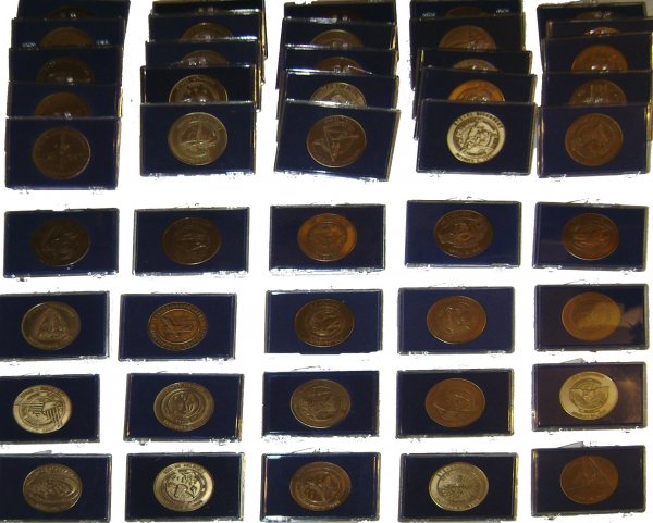Lot of 45 Shuttle Flight Commemorative Medallions: A collection of bronze medallions commemorating Shuttle flights STS 1 - 8, 11, 26 - 41, 41C, 41D, 41G, 42 - 45, 49, 50, 51A, B, C, D, F, G, I, J, L, 61B, 61C. (1.5" diameter). Each enclosed in its own
