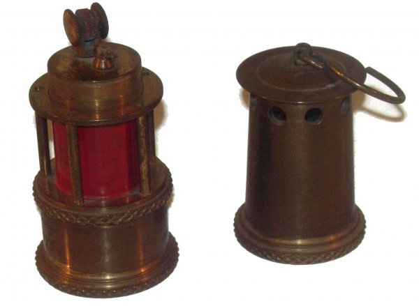 Cosmonaut Lev Demin Miner's Lamp Table Lighter: (1.5x4") A brass/glass cigarette lighter made to resemble a coal miner's lamp. This piece is inscribed: "To Lev Stepanovich Demin from coal miners. December 1975." The lighter opens in the middle. An 