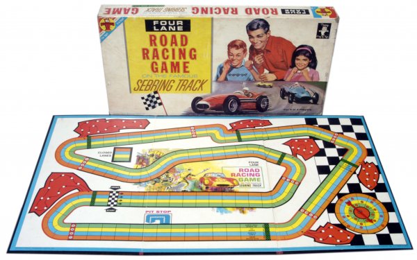 1963 "Four Lane Road" Racing Game: Transogram 1963 vintage board game in its original box. The board is in excellent condition, and the game pieces, instructions, cards and dice are all included. The cover has some edge faults and some