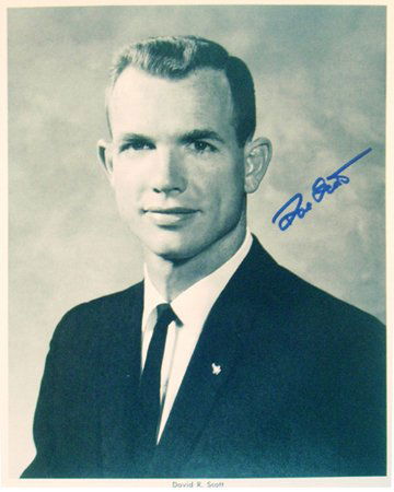 NASA Astronaut Apollo 15 David Scott Autograph: an official NASA black and white publicity photograph (8x10) of astronaut David Scott in a business suit. Scott signed in blue Sharpie. Excellent condition.