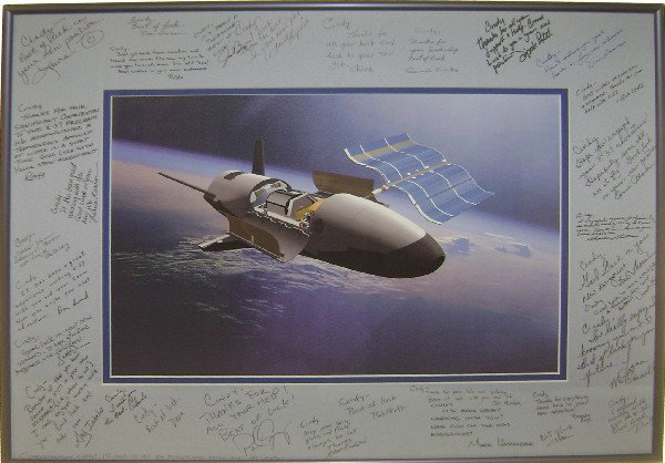 Boeing X-37 Plane Robotic Spacecraft Concept Art: (matted and framed to 20 x 16.5") The Boeing X-37 is a concept reusable robotic spacecraft that is a 120%-scaled derivative of the X-40A intended to test future launch technologies. The X-37 had its f