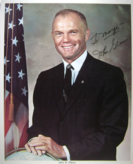 Mercury 6 Astronaut John Glenn Autograph on Litho: on a color lithograph (8 x 10") of the astronaut in his business suit. Glenn has signed in black Sharpie and inscribed "To Marge John Glenn". Very good condition.