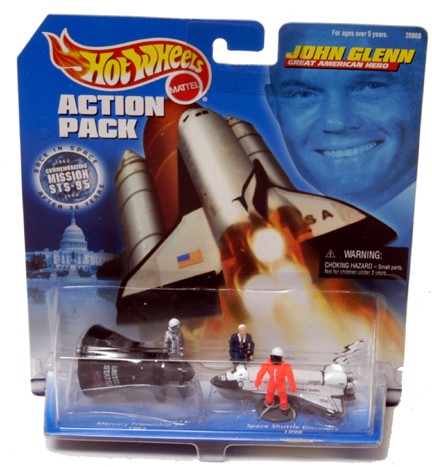 Mercury 6 & Shuttle Glenn Hot Wheels Action Figure: An unopened blister-pack containing Hot Wheels models of the Mercury 6 spacecraft Friendship 7 and Space Shuttle Discovery STS 95, which was John Glenn's return to space. Also included are three small
