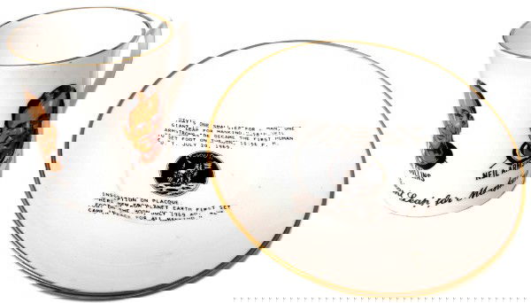 Apollo 11 Comemorative Cup and Saucer: Bone china commemorative cup and saucer made by Veletta's Arts of England. The cup bears a portrait of each of the astronauts, while the saucer reads "That's one small step for a man, one giant leap f