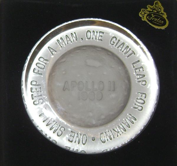 Apollo 11 Paperweight In Original Box: (3.75") Apollo 11 glass paperweight. Inlaid with "Apollo 11, 1969, One Giant Leap for Mankind One Small Step For A Man." Excellent condition. In original box with a sticker that reads "Authentic Fento
