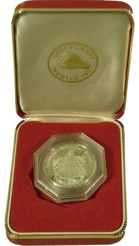Apollo 12 Commemorative Sterling Medallion: Manufactured by Space Craft Medals, Inc. this medallion (1.5" diameter) is in excellent condition in its origiinal case. Minor tarnish. Features the logo for the Apollo program on the obverse and the