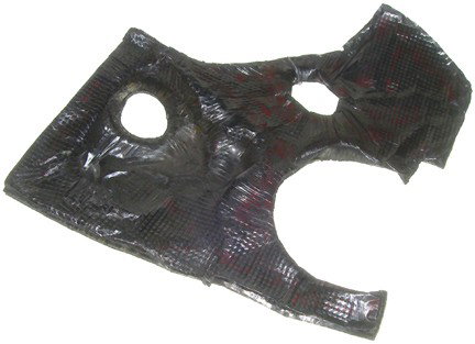 Shuttle High Temperature Insulation: An irregular piece of insulation (approx. 15 x 17") bearing serial numbers "99167-H726577-7, 22013-224H28693-7, V8A95". The insulation has two circular apertures near its center. Very good condition.