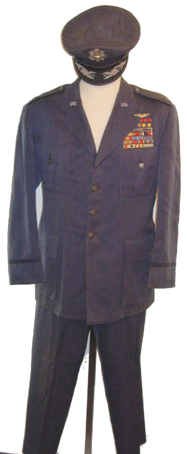 USAF Space Command John E. Pryor Uniform: A USAF uniform for John E. Pryor, an officer involved in the space program, including his jacket, hat, and slacks. Accompanied by approx. 20 black and white photographs (8 x 10") and 4 service awards.