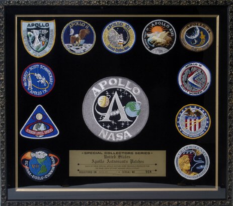 Apollo Mission Patches: proudly and elegantly displayed in a black-gold toned shadow box frame (to 23x26"). In the center of the frame is an oversize NASA patch (7.5" diameter) above a "Special Collectors Series" plate. Crea