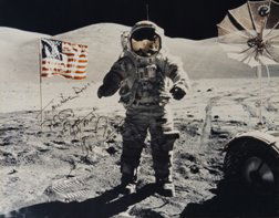 Apollo 17 Eugene Cernan Autograph: on a color NASA photograph (16 x 20") of him on the lunar surface. Cernan has signed in black Sharpie and inscribed it "To Michael Davis." Also included in this lot are 6 other unsigned Apollo era pho