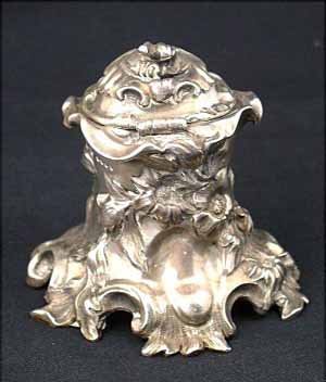 Victorian silver ink well, of rococo for: Victorian silver ink well, of rococo form, decorated with acanthus, c-scrolls, maker Charles Thomas Fox and George Fox, lid dated London 1846, main body 1842, 5oz.
