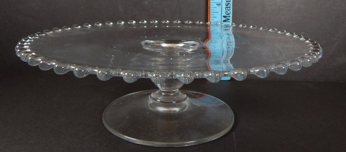 CLEAR CRYSTAL DECO PIE SERVING DISH: CLEAR CRYSTAL DECO PIE SERVING DISH. CLEAR W/ AWESOME CRYSTAL BALLS DECORATING THE RIM OF THE DISH.