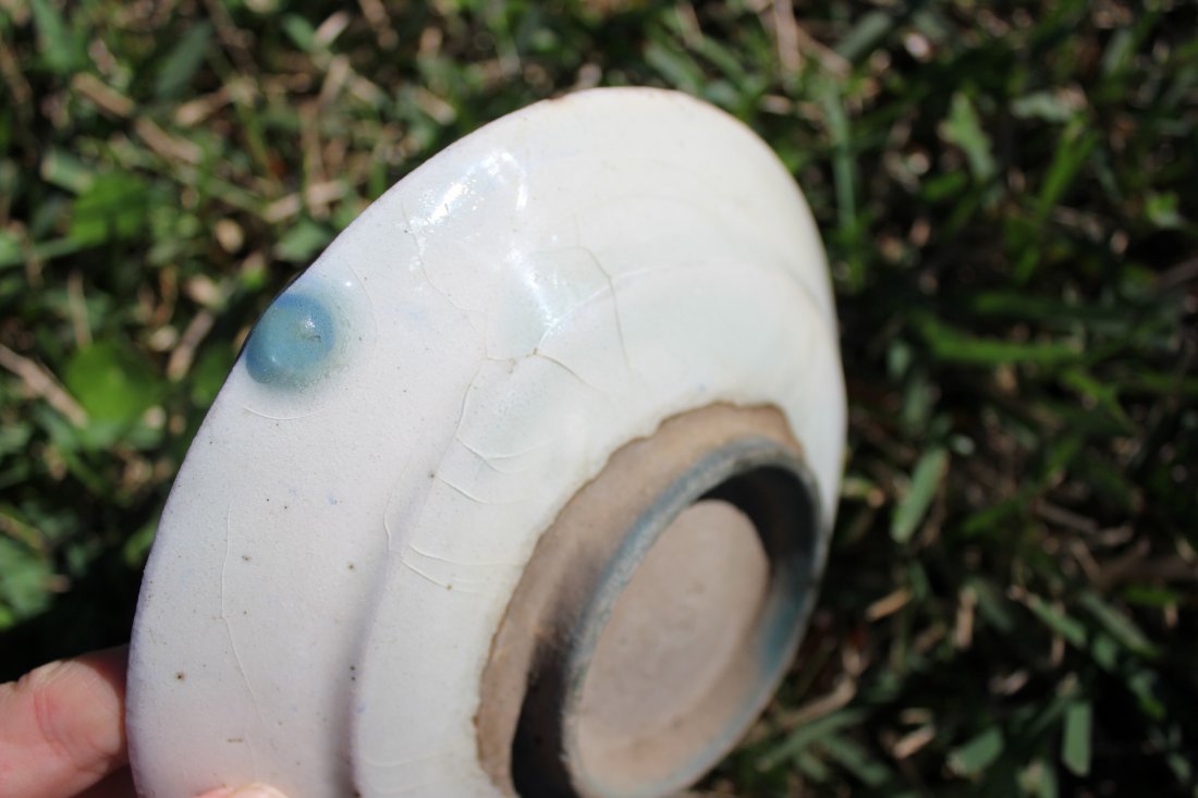 Persian antique hand painted glazed pottery plate: Persian antique hand painted glazed pottery plate with glaze bubble at the back.Up for auction is an antique Persian Hand Painted glazed pottery plate. The painting has an amazing unique leaking appea