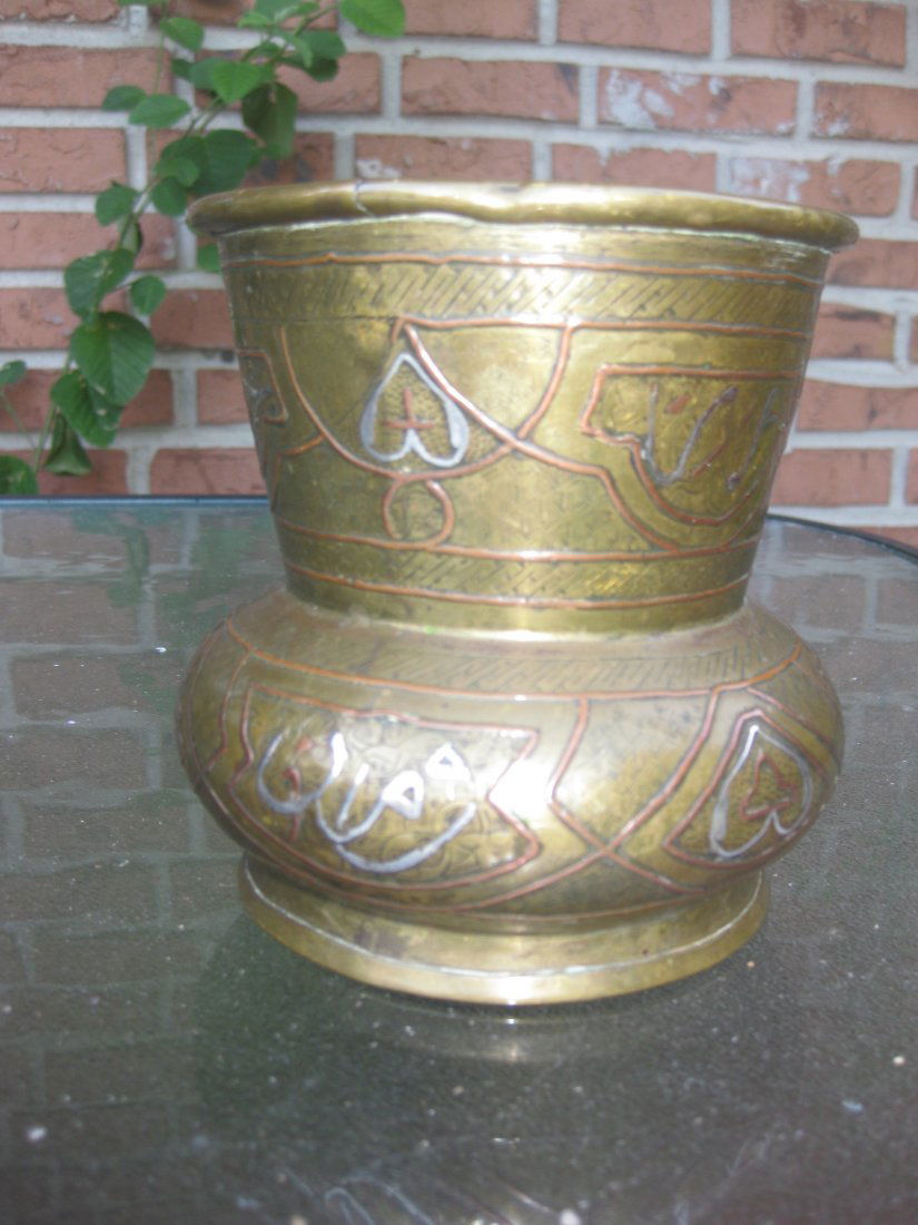 Syrian, Antique Islamic brass, silver inlay bowl: Syrian, Islamic metal-ware, dating from the first half of the last century - c. 1910. A good brass vase, hand raised and jointed - the circular base applied, crimped and soldered. The surfaces are dec