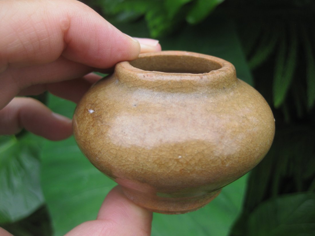 Six dynasties 222-589 Glazed Scholars Water Dropper: Evaluated by Dr. Qing Chang, PhD as Six Dynasties 222-589 AD, Chinese sienna (yellow-brown) glazed pottery Scholars' Water Dropper. The bottom is not glazed. There are 3 Chinese characters at the bott