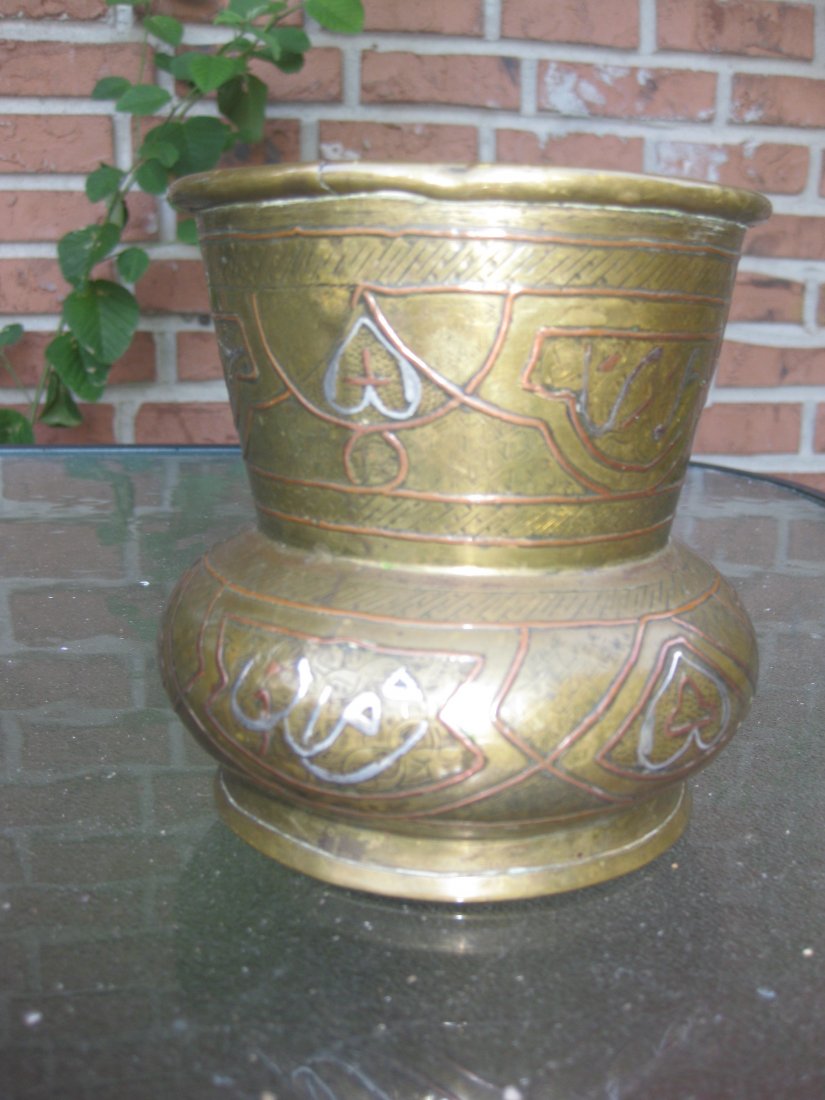 Syrian, Antique Islamic brass, silver inlay bowl: Syrian, Islamic metal-ware, dating from the first half of the last century - c. 1910. A good brass vase, hand raised and jointed - the circular base applied, crimped and soldered. The surfaces are dec