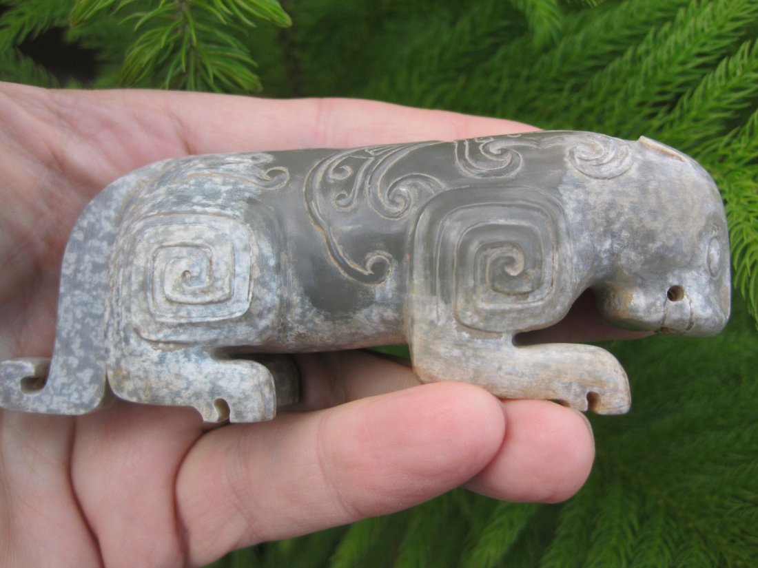 Chinese small grey jade tiger, Western Zhou (1122-771BC: Chinese small antique grey jade tiger, Western Zhou (1122 B.C. -771B.C.). Length: 4.5 in. = 11 cm; Weight: 8 oz. = 230g. The archaic evidences of differential weathering, diffusive markings and cleavi