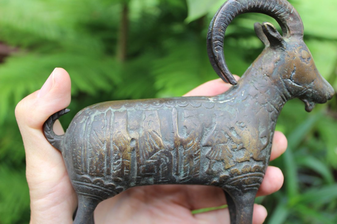 Middle Eastern antique bronze goat- 10 warriors & tiger: Middle Eastern antique bronze goat with 10 warriors fighting 2 tigersLength: 6.5 in. = 17 cmHeight 6.5 in. = 16 cmWeight: 1 lb. 70z = 630 g