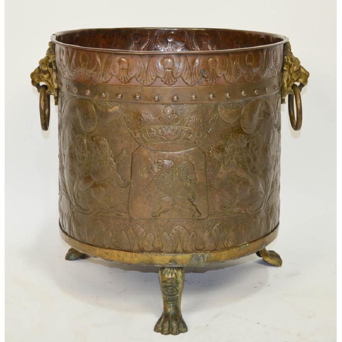 Embossed Copper Claw Foot Lion Head Pot: Belgian copper and bronze pot with stunning embossing throughout. One side features the coat of arms of Antwerp, Belgium with its famous lions, topped by the royal crown and the other side has a sceni