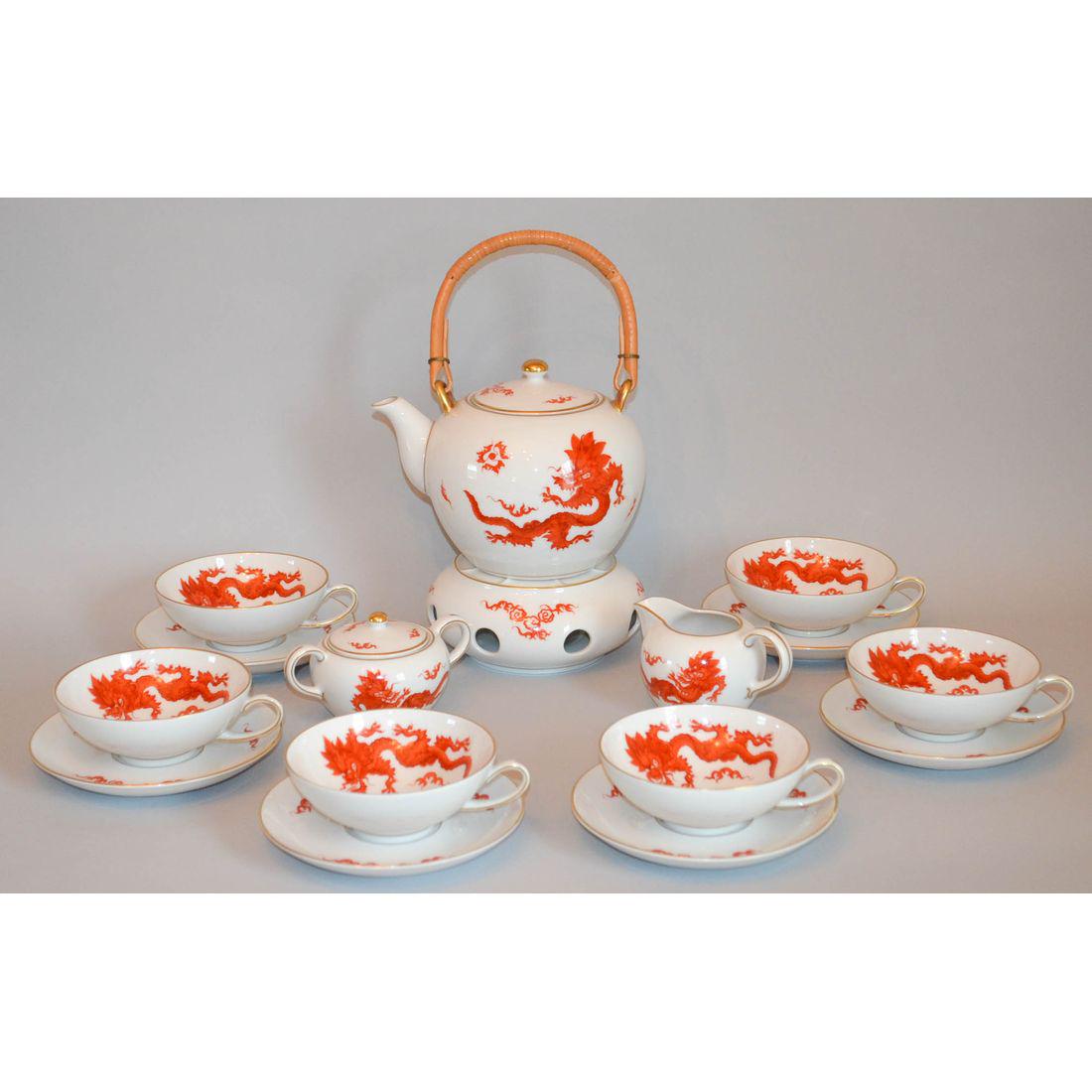 Meissen Dragon Porcelain Tea Set, MPM Saxonia: A stunning and exquisite quality tea set compromised of six hand painted porcelain china tea cups with saucers, creamer, sugar bowl and tea pot with a base for a candle. Every piece is stunningly hand