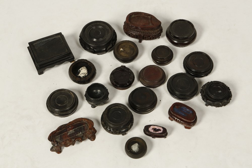 A COLLECTION OF HARDWOOD SNUFF BOTTLE STANDS and stoppe: A COLLECTION OF HARDWOOD SNUFF BOTTLE STANDS and stoppers etc (a lot) Provenance: The Anthony Bate Collection of Chinese Snuff Bottles and Works of Art.