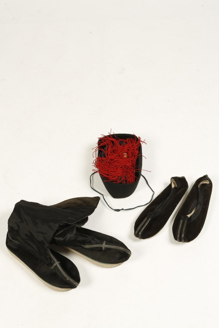 A BLACK SILK AND FELT MANDARIN HAT with red tassels, an: A BLACK SILK AND FELT MANDARIN HAT with red tassels, and a pair of mens boots and shoes, all late Qing (3)
