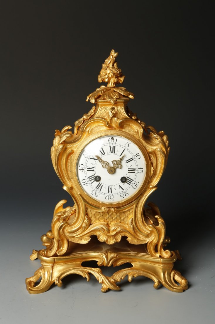 A 19TH CENTURY FRENCH ORMOLU MANTEL CLOCK, with a conve: A 19TH CENTURY FRENCH ORMOLU MANTEL CLOCK, with a convex white enamel dial with Roman numerals, with an eight-day two-train movement striking on a bell, the movement stamped 'L.F. 38195', the waisted