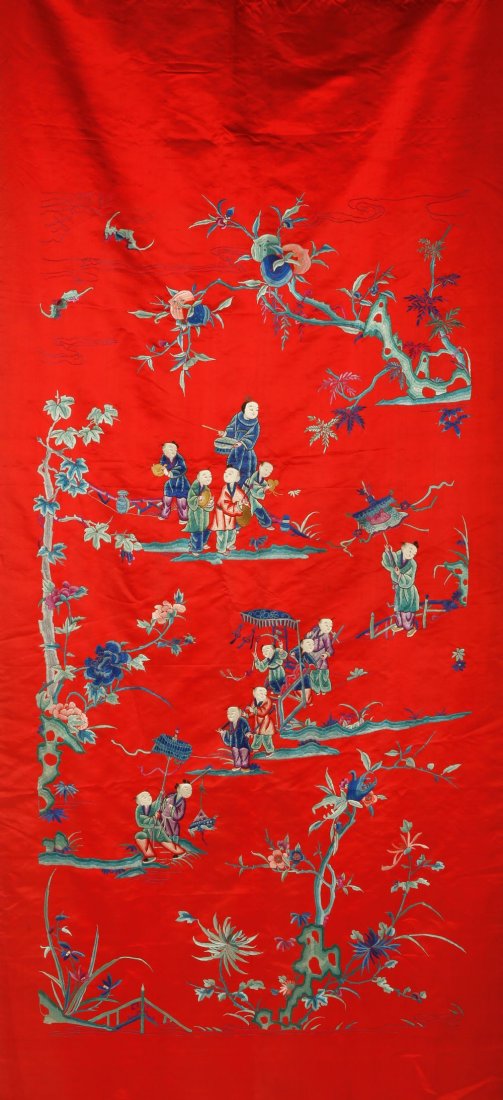 A CHINESE SILK-EMBROIDERED HANGING showing a procession: A CHINESE SILK-EMBROIDERED HANGING showing a procession of a child dignitary with attendants and musicians, in a landscape with bats and peaches, late Qing/Republic, circa 80" high.