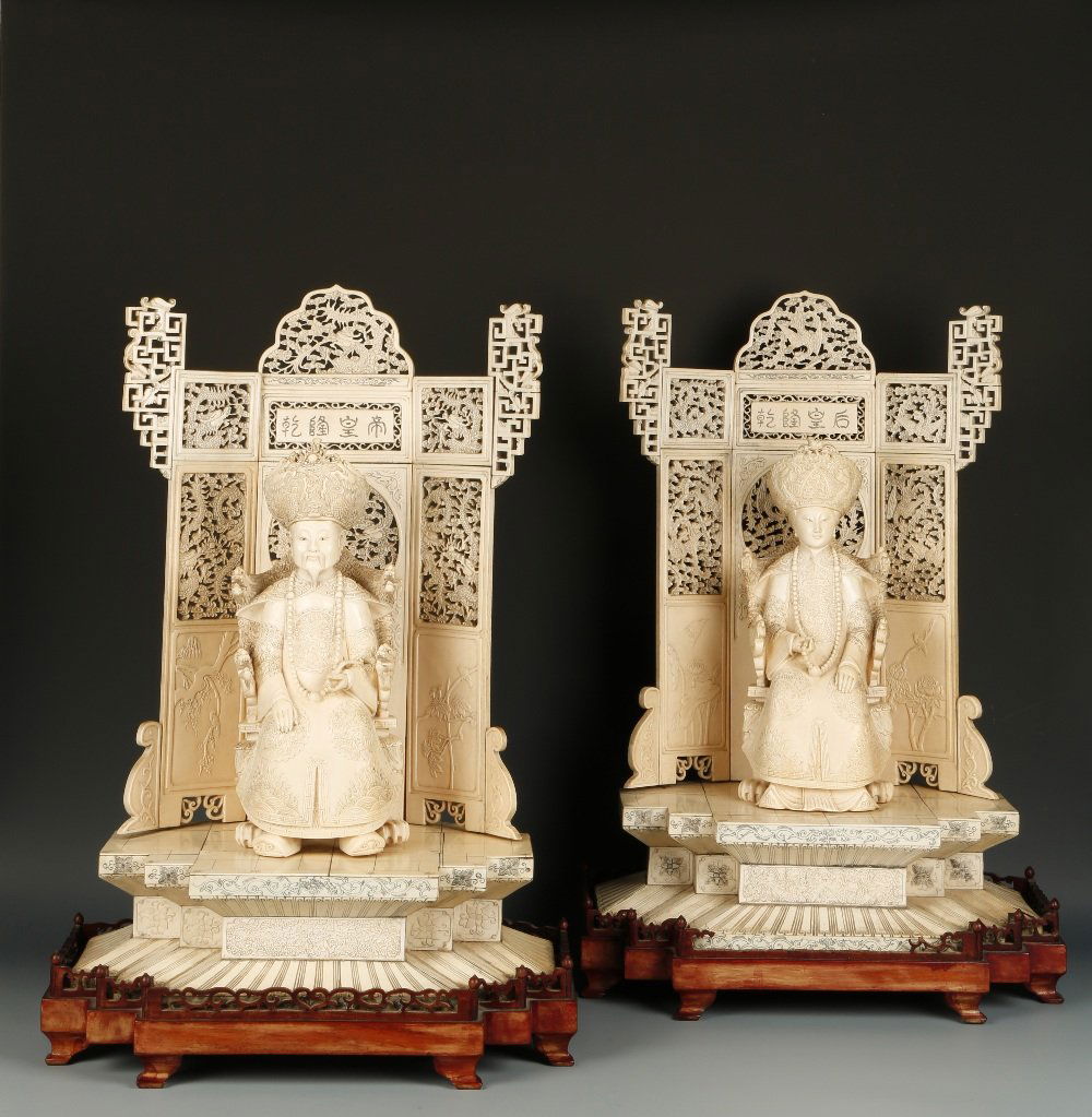 A LARGE PAIR OF CHINESE IVORY THRONE FIGURES of the