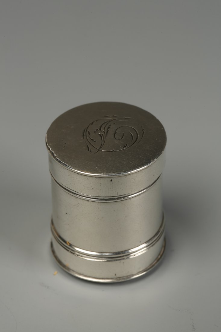 A GEORGE III NUTMEG GRATER of cylindrical form, one end: A GEORGE III NUTMEG GRATER of cylindrical form, one end with an engraved initial, by Samuel Pemberton, Birmingham 1790, 1" long. See illustration