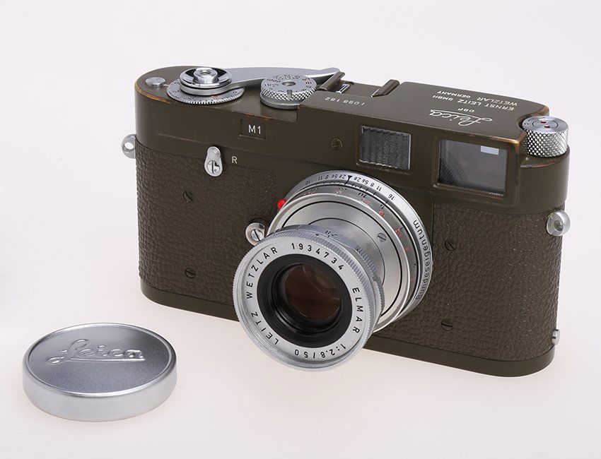 M1 Olive Bundeseigentum Military Camera Set #1098182: Leica M1 for Bundeseigentum Military, engraved “Bundeseigentum” on the back of top plate. It comes with an Elmar 2.8/50mm (#1934734) also engraved “Bundeseigentum” on barrel. A total of 208 un