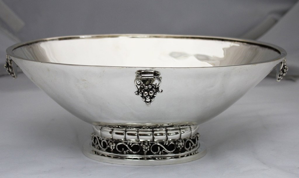 Georg Jensen United States Sterling Center Bowl: Rare vintage large sterling silver raised grape cluster motif center bowl, made by Georg Jensen in the United States c. 1940-45. It was made during a short five year period when George Jensen USA was 